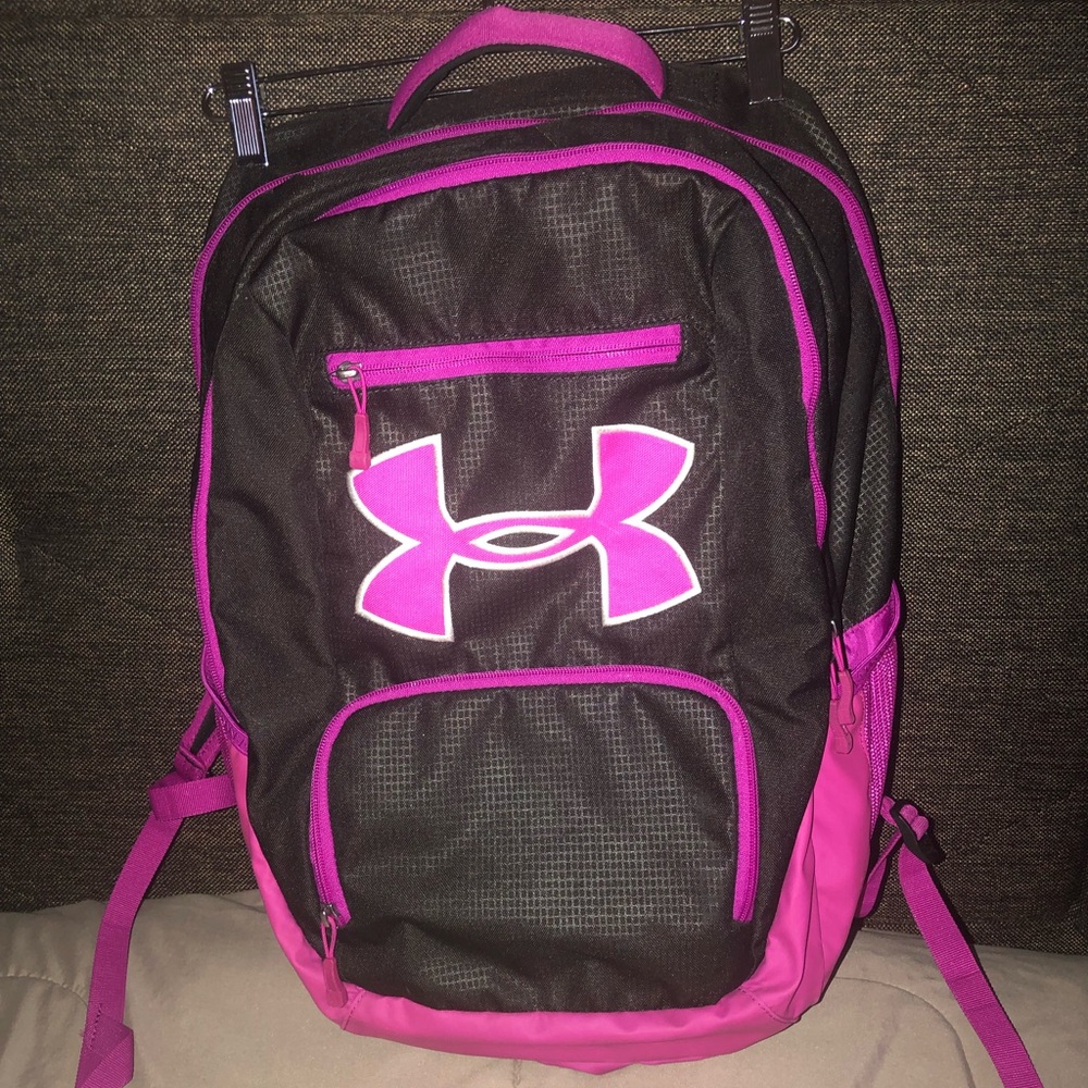 Under Armour pink and black waterproof backpack